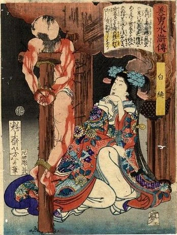 Shiranui kneeling beside a crucified man
